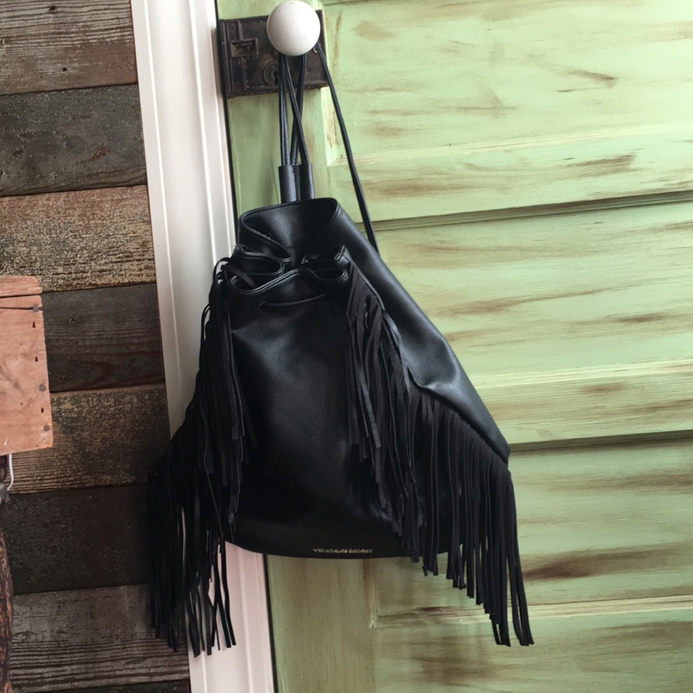 Black Victoria’s Secret bag.